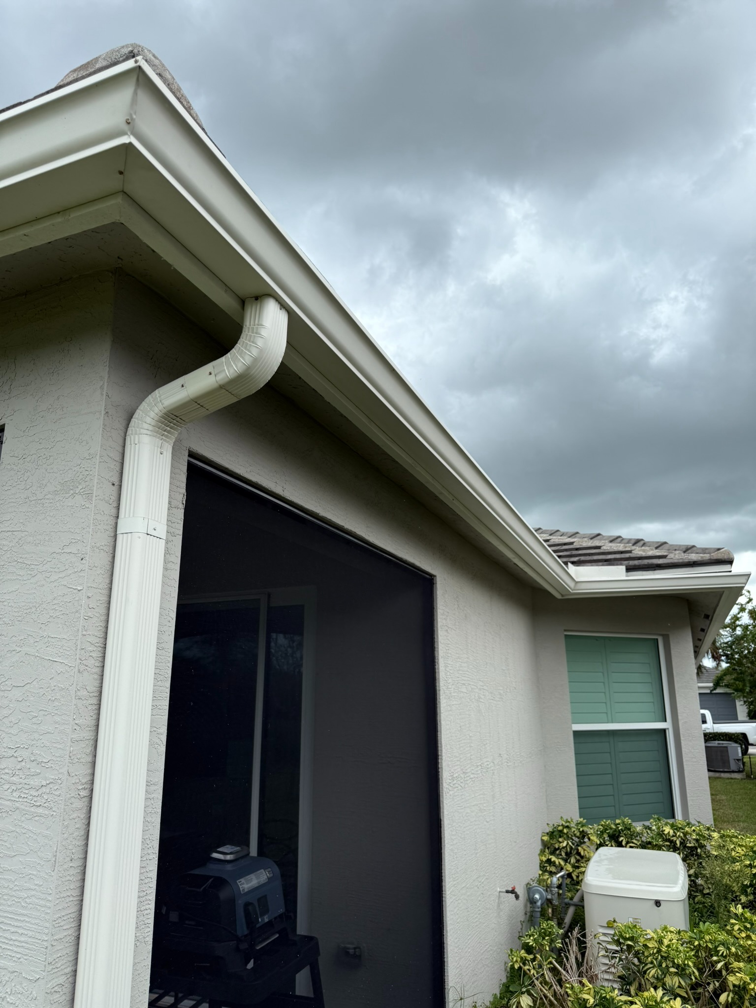 Gutter cleaning, rear porch run in Tradition, FL — after