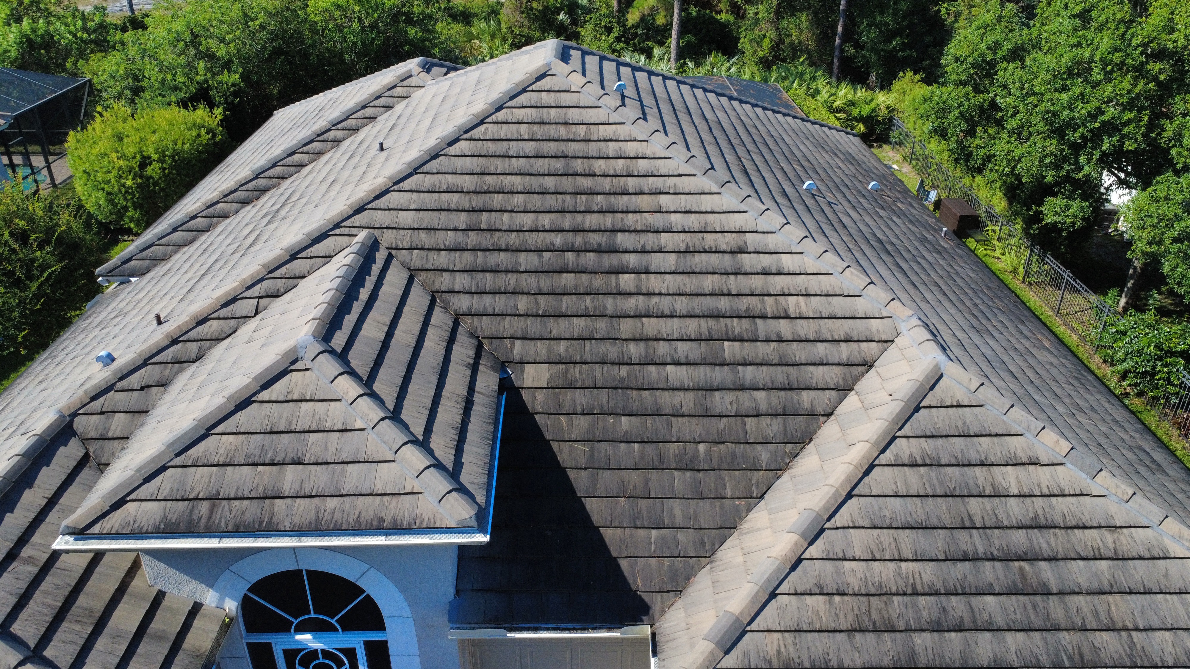 Roof before soft washing in Vero Beach, FL
