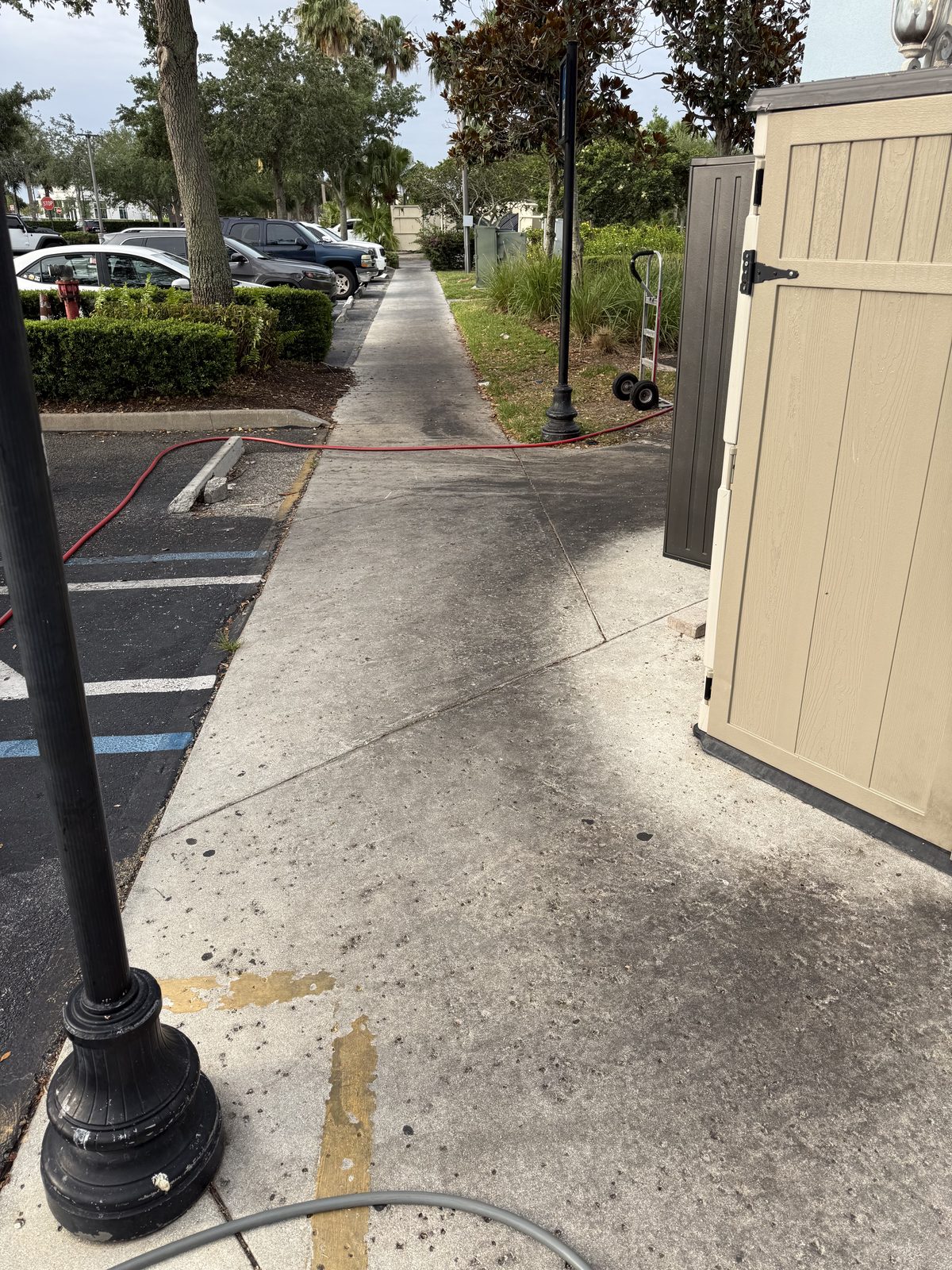 Parking lot sidewalk — before